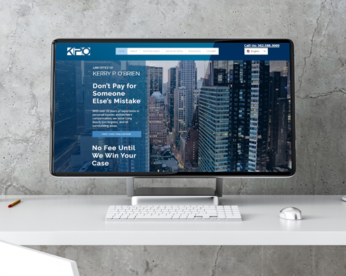 Image of desktop computer with screenshot of Kerry O'Brien website